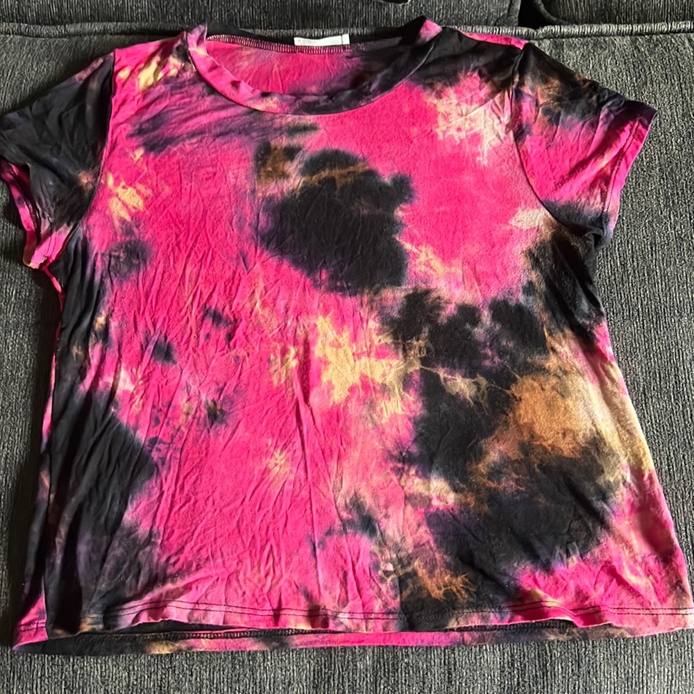 Colorful cute shirt being sold.